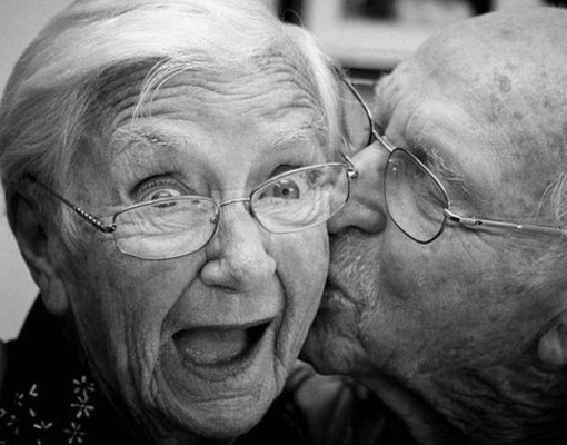 Old couple kissing